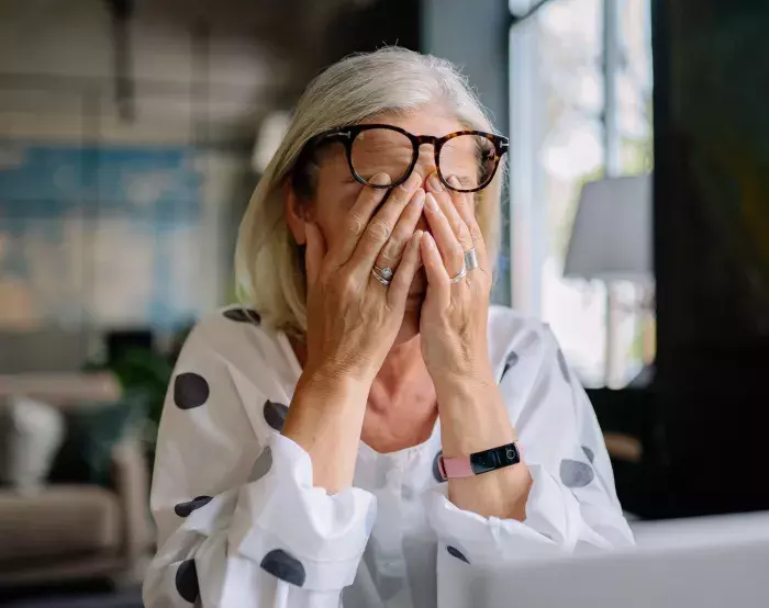 tired woman smartwatch